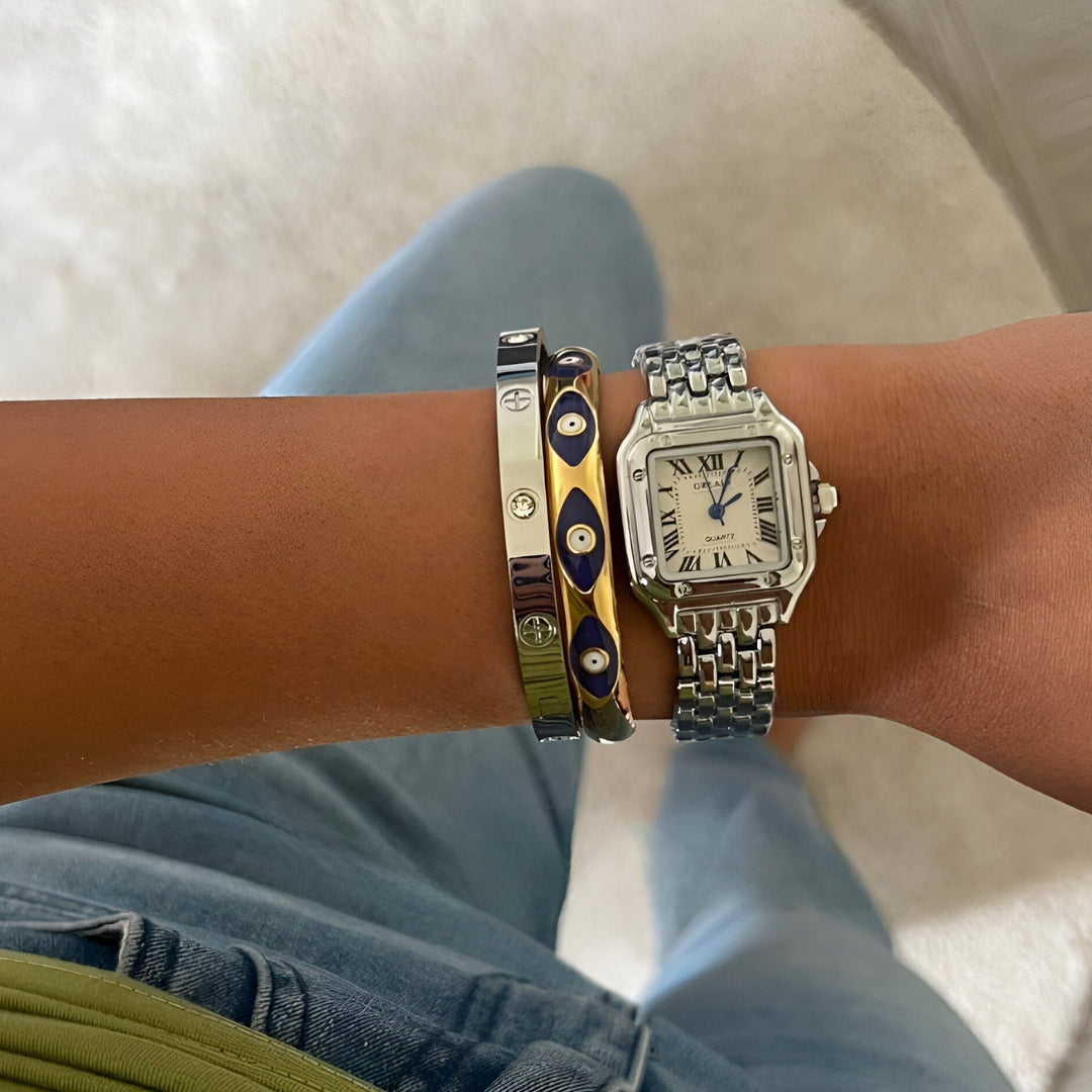 GREALY MAINSINA HORLOGE